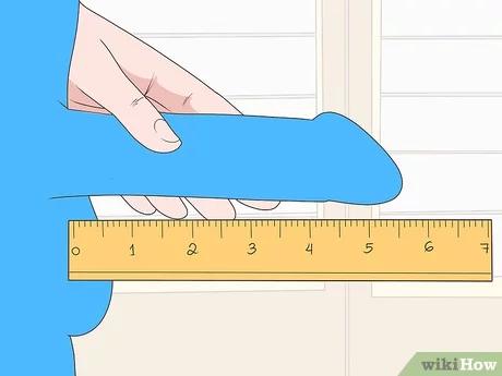 Step 2 اجعل قضيبك مستويًا على المسطرة أو شريط القياس.